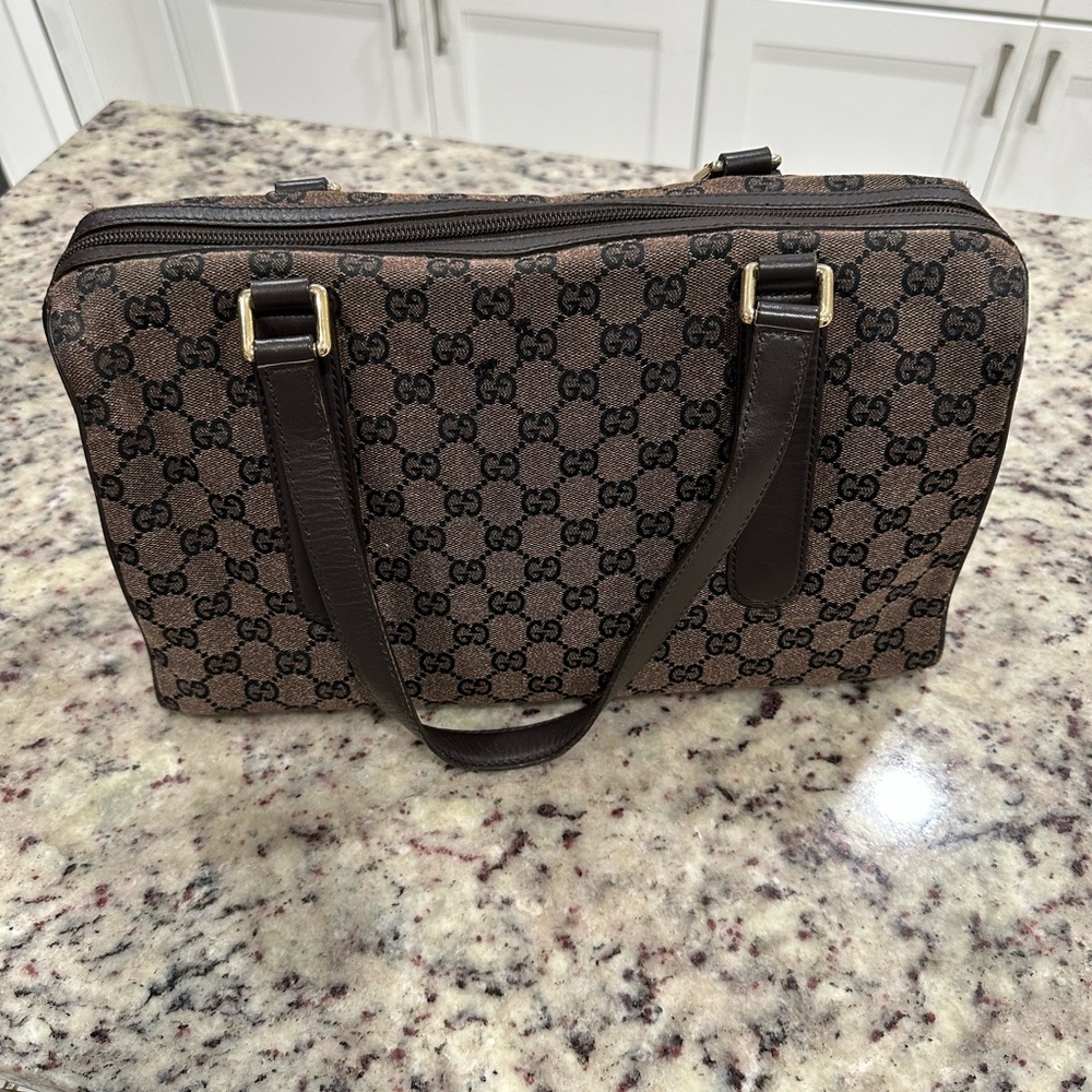 Gucci GG Canvas Boston Satchel Bag in brown.